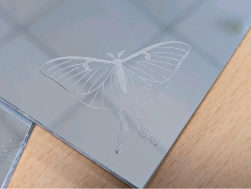Engraving into the back of mirrored acrylic