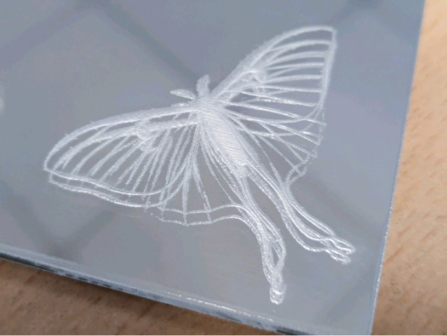 Engraving into the front of mirrored acrylic